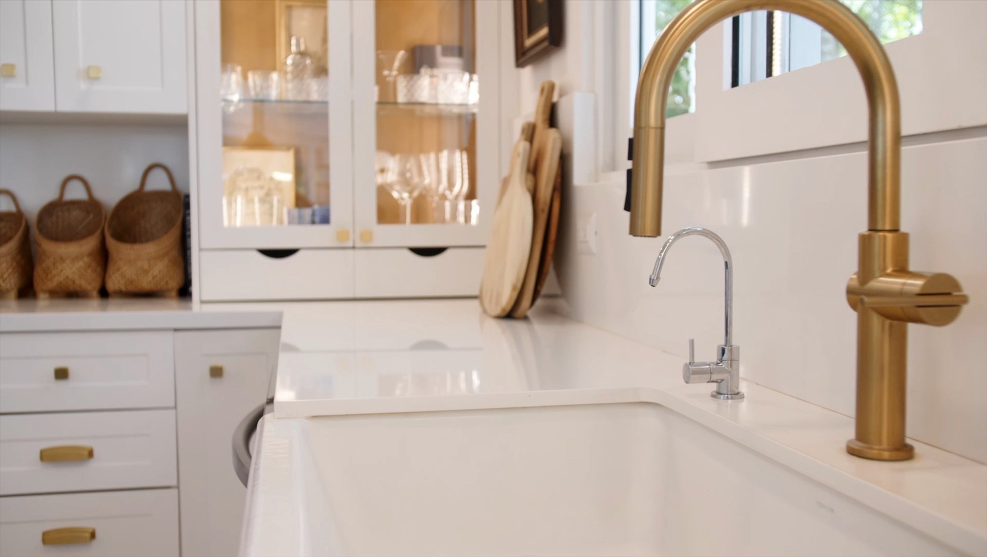 Brass tap over a deep farmhouse sink