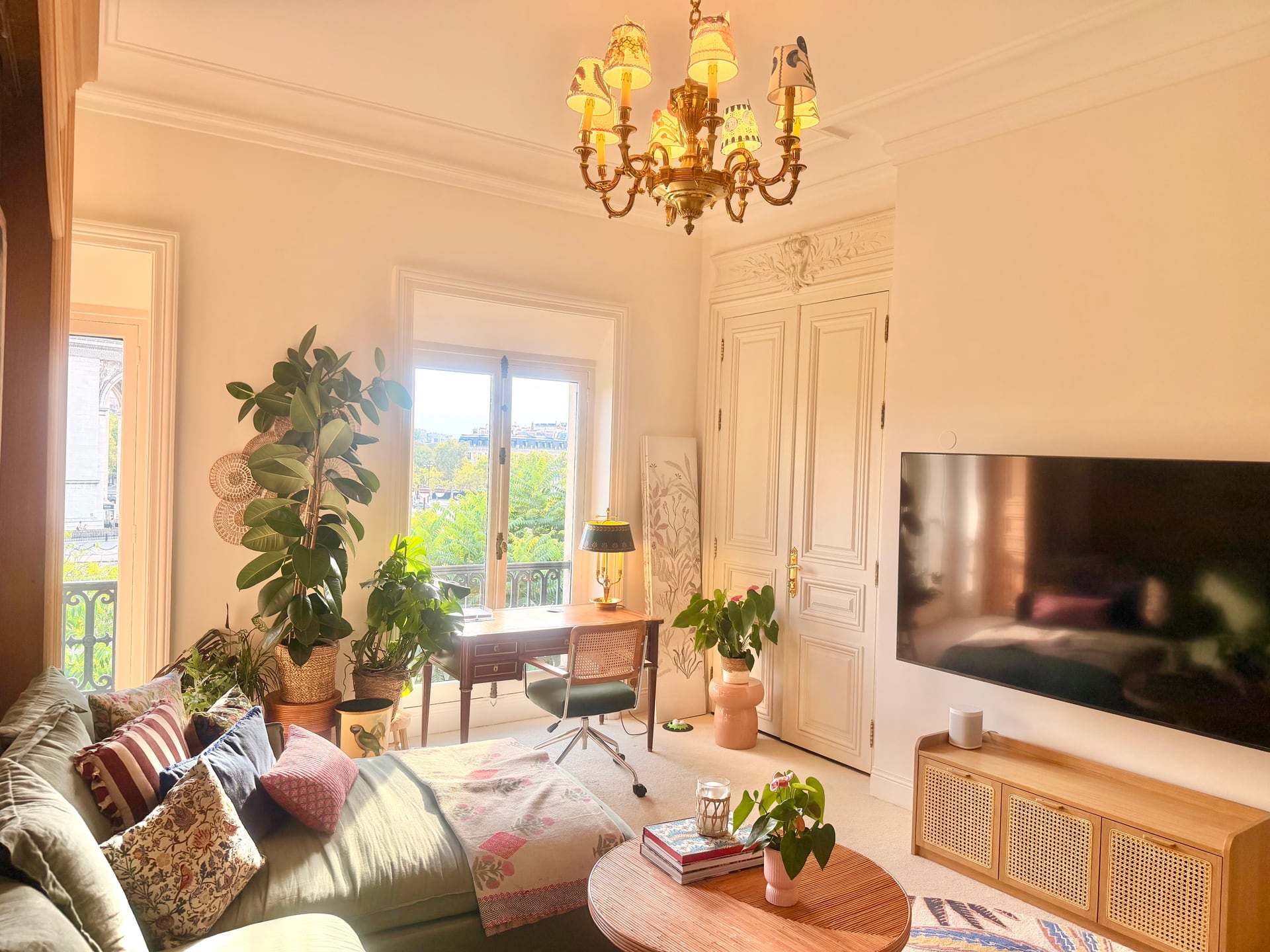 The screen side of the den under the chandelier